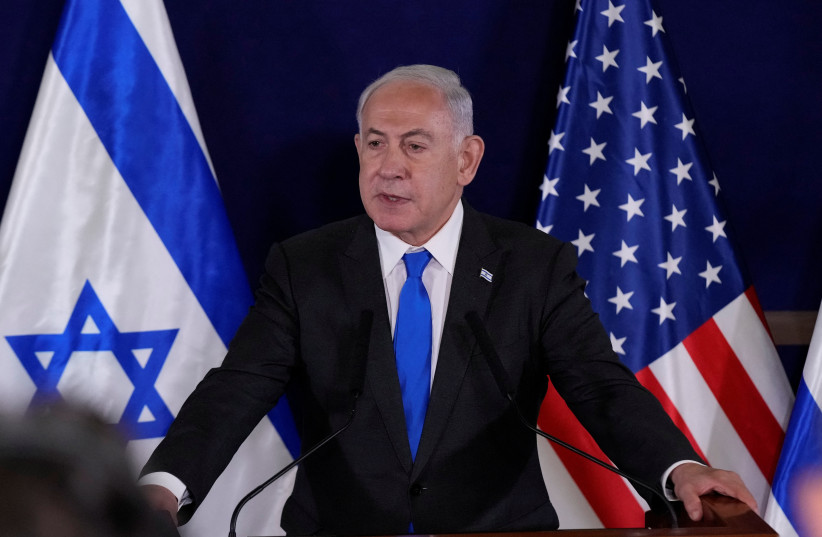  Israel’s Prime Minister Benjamin Netanyahu makes a statement to the media inside The Kirya, which houses the Israeli Ministry of Defense, after a meeting with U.S. Secretary of State Antony Blinken, in Tel Aviv, Israel, Thursday Oct. 12, 2023. (photo credit: Jacquelyn Martin/Pool via REUTERS)