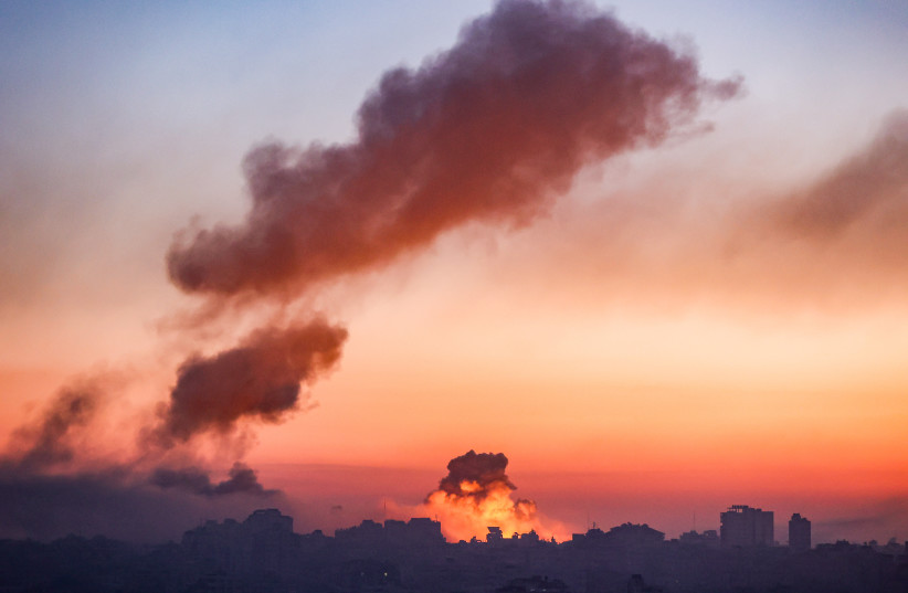 Smoke rises after an Israeli airstrike in Gaza City, on October 13, 2023 (photo credit: ATIA MOHAMMED/FLASH90)