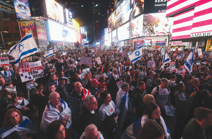  People gather for a demonstration at Times Square to express solidarity with Israel, amid the ongoing conflict between Israel and the Palestinian Islamist group Hamas, in New York City, U.S., October 19, 2023 (photo credit: REUTERS/MIKE SEGAR)