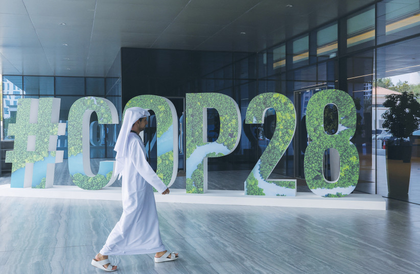  THE COP28 insignia is on display in Abu Dhabi, ahead of the conference in the UAE, which gets underway at the end of this month.  (photo credit: Amr Alfiky/Reuters)
