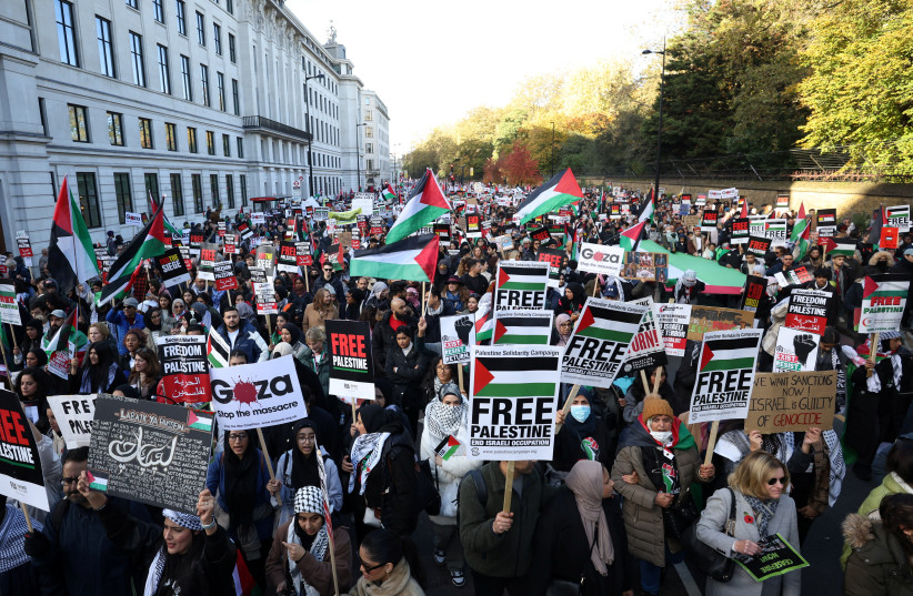  Demonstrators protest in solidarity with Palestinians in Gaza, in London, on Saturday. (photo credit: HOLLIE ADAMS/REUTERS)