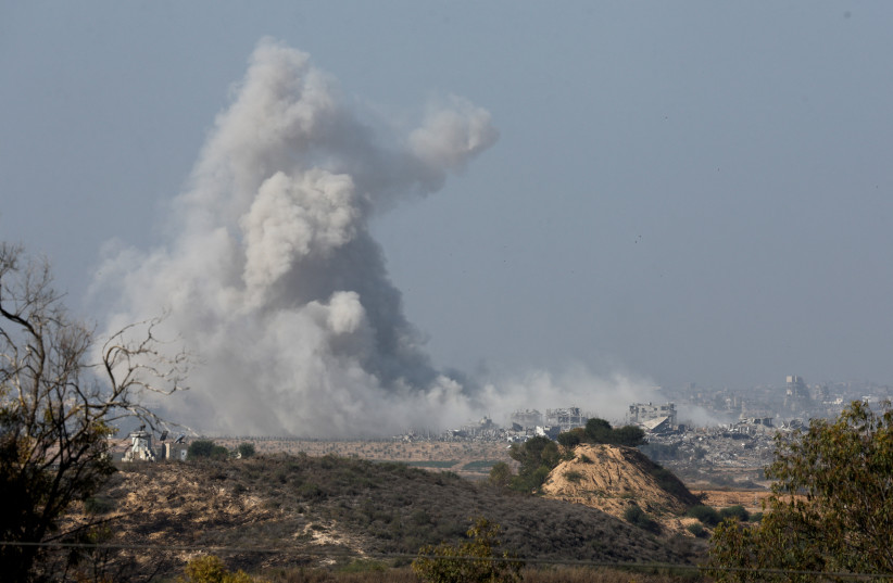  Smoke rises over northern Gaza following Israeli air strikes, after a temporary truce between Israel and the Palestinian terrorist group Hamas expired, as seen from Israel's border with Gaza in southern Israel, December 1, 2023. (photo credit: AMIR COHEN/REUTERS)
