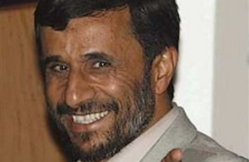 ahmadinejad smiles298.88 (photo credit: AP)