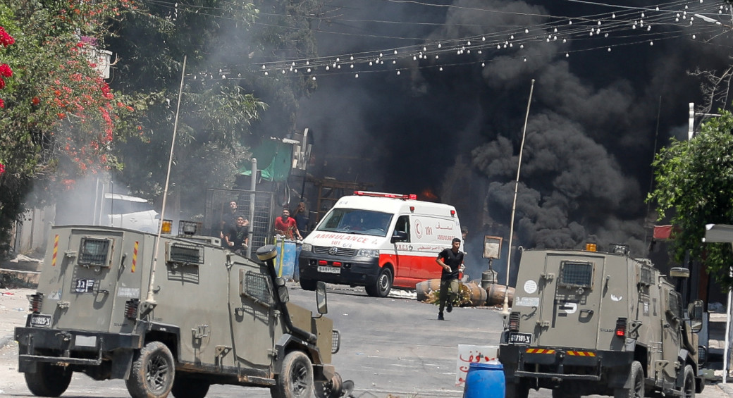  Palestinians clash with Israeli forces during an Israeli military operation in Jenin, in the West Bank July 3, 2023 (photo credit: REUTERS/RANEEN SAWAFTA)