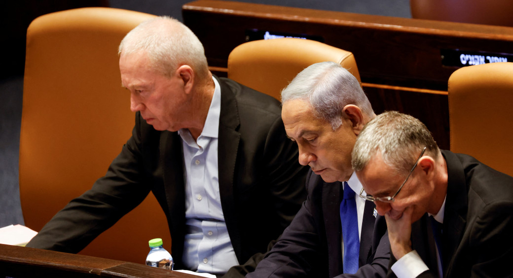  Prime Minister Benjamin Netanyahu sits between Justice Minister Yariv Levin and Defense Minister Yoav Gallant at the Knesset plenum in Jerusalem July 24, 2023 (photo credit: REUTERS/AMIR COHEN)