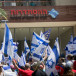  Medical staff demonstrate outside the Histadrut building in Tel Aviv during a 24-hour strike in response to the government's judicial overhaul, on July 25, 2023