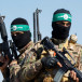  Palestinian fighters from the armed wing of Hamas take part in a military parade to mark the anniversary of the 2014 war with Israel, near the border in the central Gaza Strip, July 19, 2023.