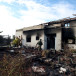  An Israeli soldier walks towards the remains of a burnt house, following a deadly infiltration by Hamas terroirsts from the Gaza Strip, in Kibbutz Beeri in southern Israel October 17, 2023