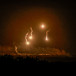  Flares burn in the sky as seen from the Israeli side of the border with Gaza, in southern Israel, November 7, 2023.