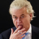 Dutch far-right politician and leader of the PVV party, Geert Wilders licks his finger as he meets with members of his party at the Dutch Parliament, after the Dutch parliamentary elections, in The Hague, Netherlands November 23, 2023