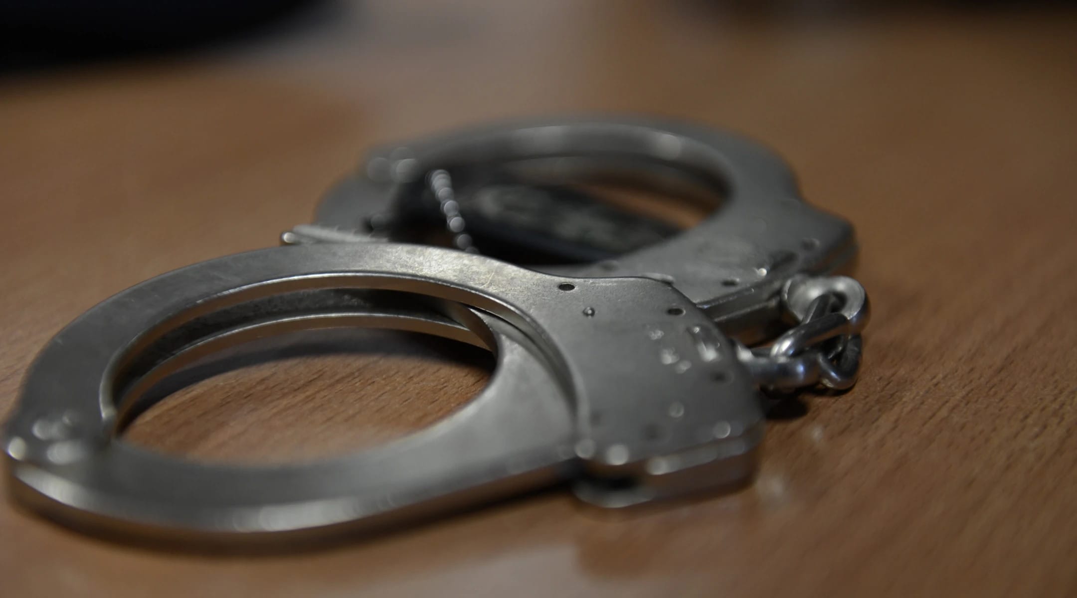 Handcuffs on table.