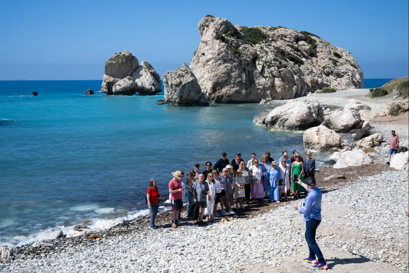 Tourists at Aphrodite's Rock in Cyprus