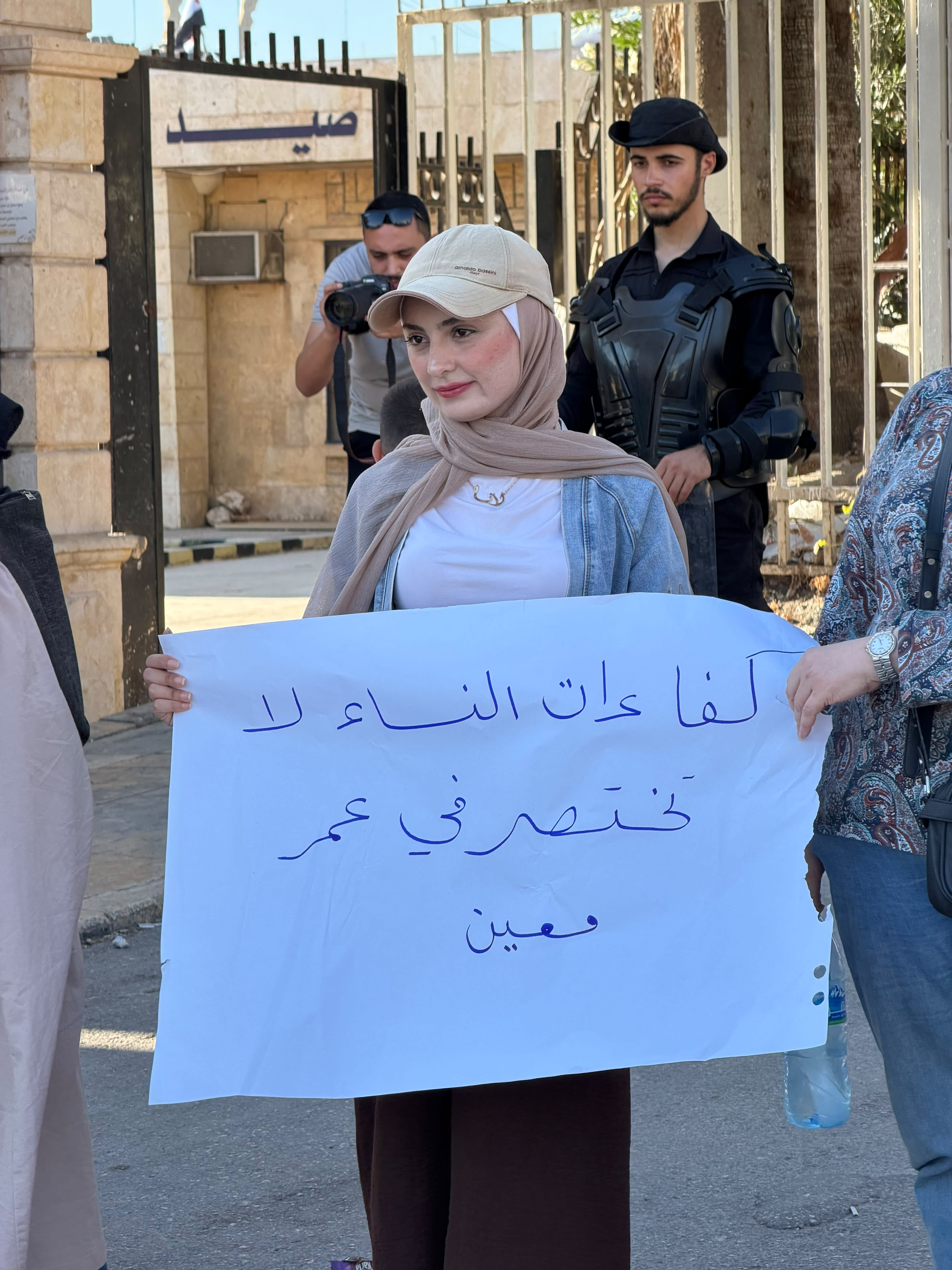 Women activists protest in Aleppo against what they say is inadequate female representation in Syria's newly formed People's Assembly, July 2.