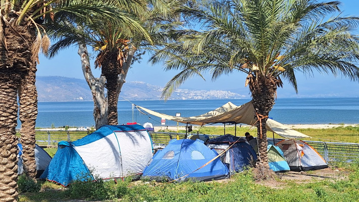 Vacationers at the Sea of Galilee.