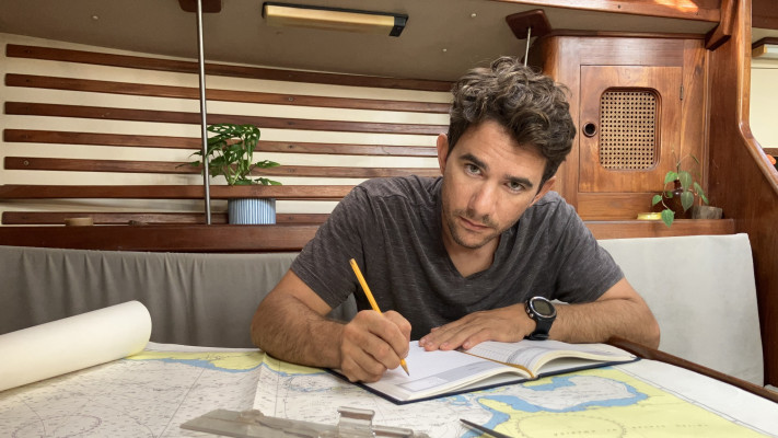 Daniel Pinsky and the charts that will guide him throughout the race.