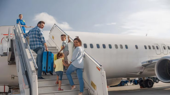 Family boarding a plane.