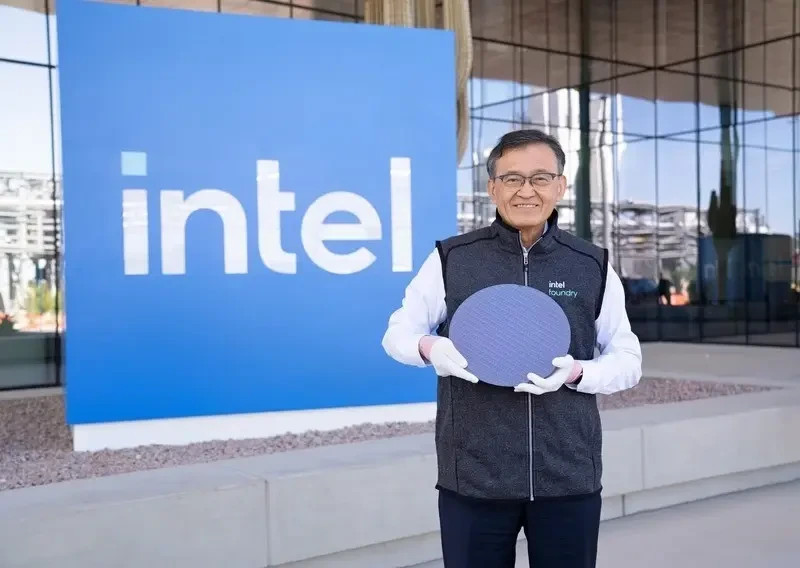 Intel CEO Lip-Bu Tan holding a Panther Lake processor silicon wafer