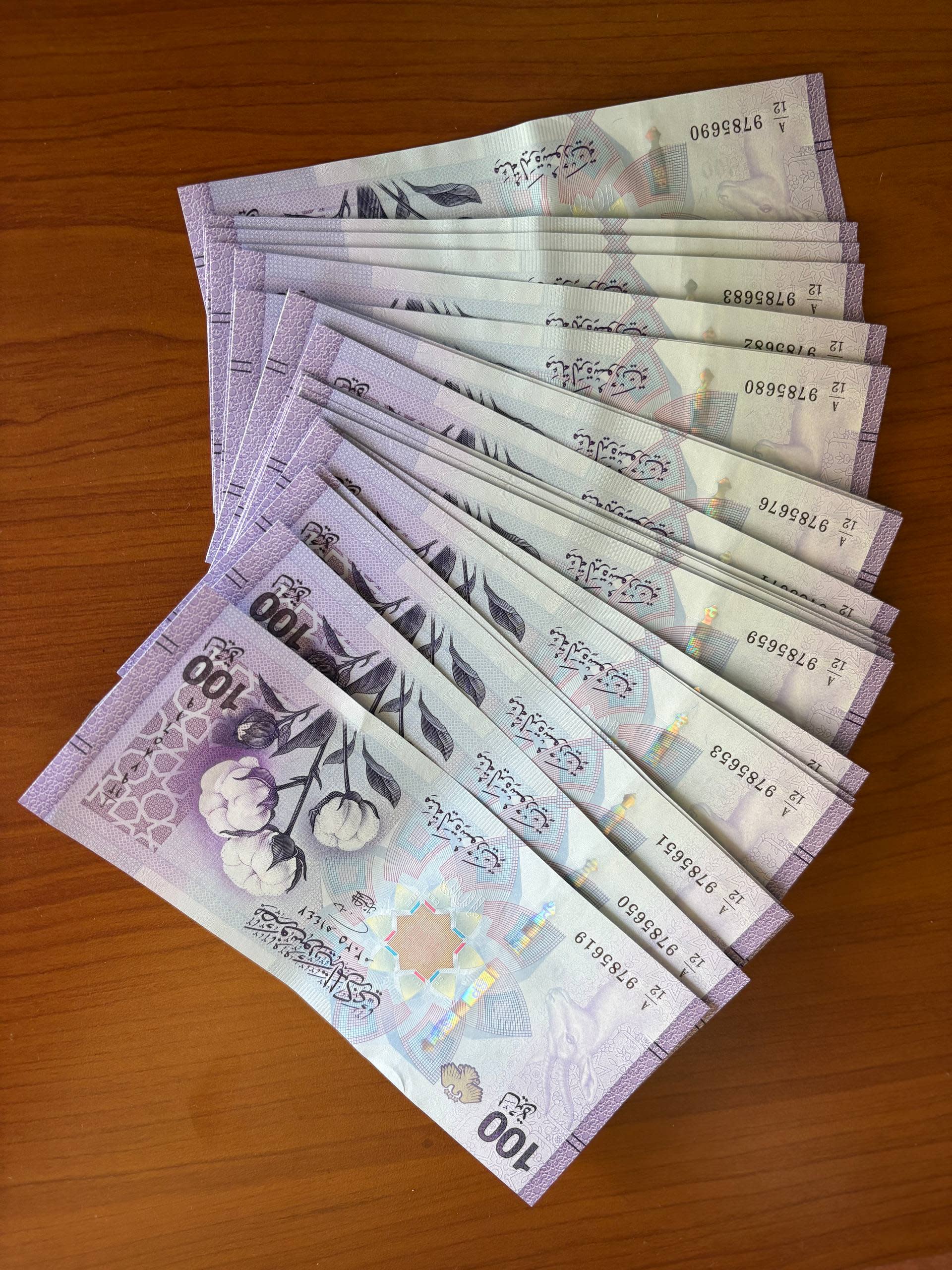 Syrian banknotes in denominations of 1,000, 2,000, and 5,000 pounds, issued during the Assad era, ahead of the deadline for the old currency to be withdrawn from circulation.