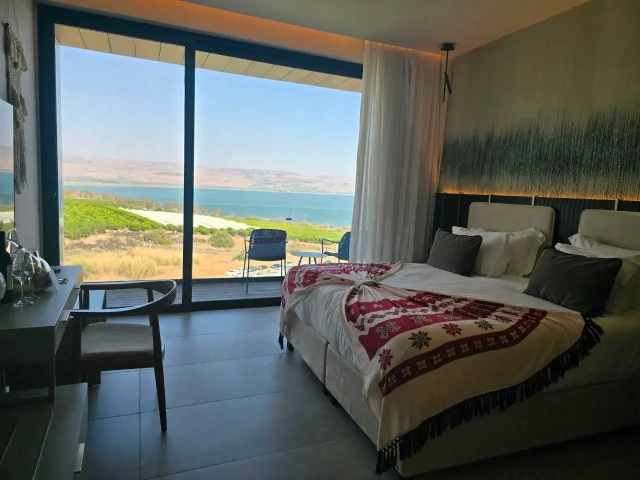 The Sea of Galilee's blue waters stay with you from every angle. Standard room at David's Harp Galilee Resort