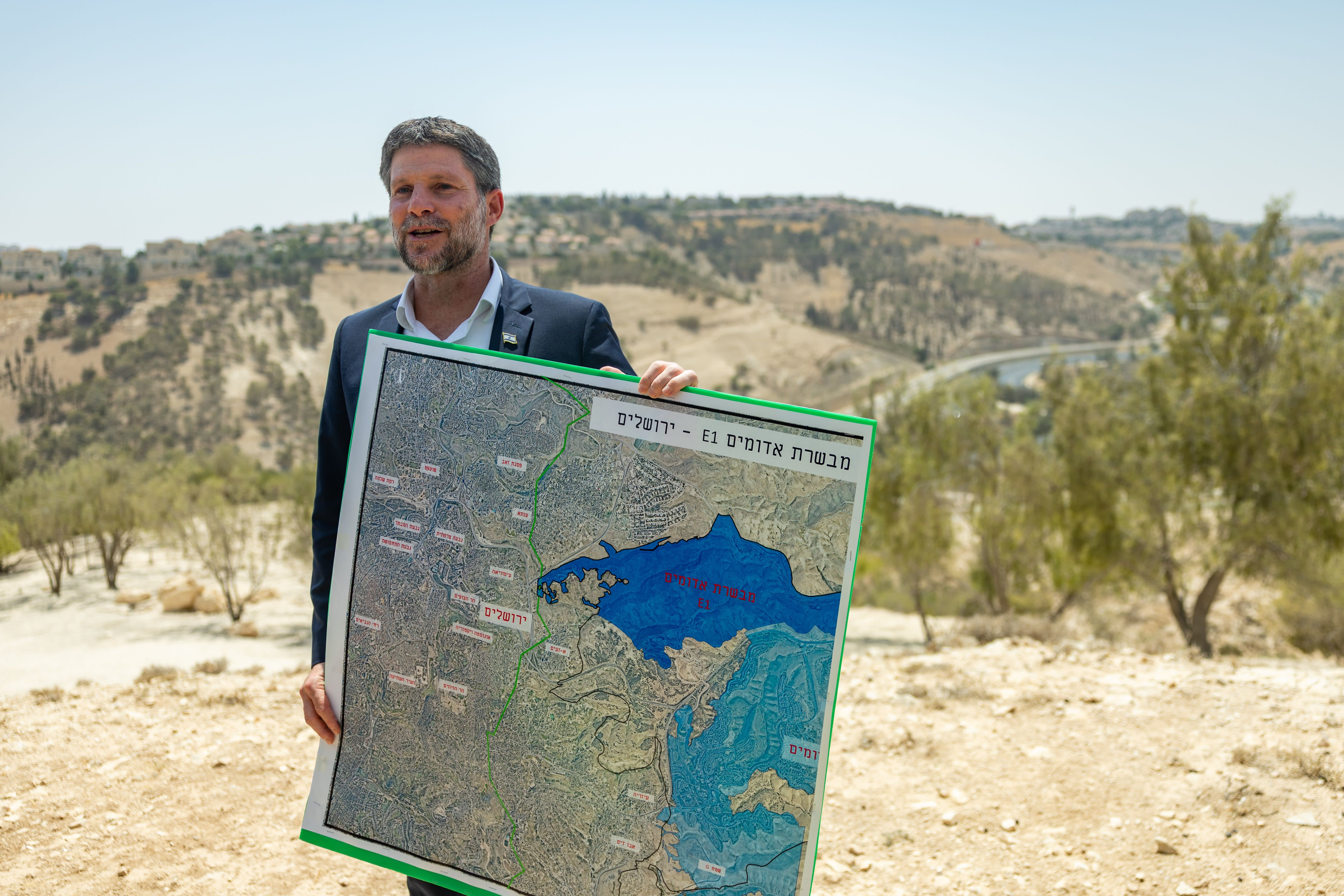 Israeli Finance Minister Bezalel Smotrich attends a press conference announcing his plans to approve more than 3,000 housing units in the E1 settlement project between Jerusalem and Ma’aleh Adumim, August 14, 2025.