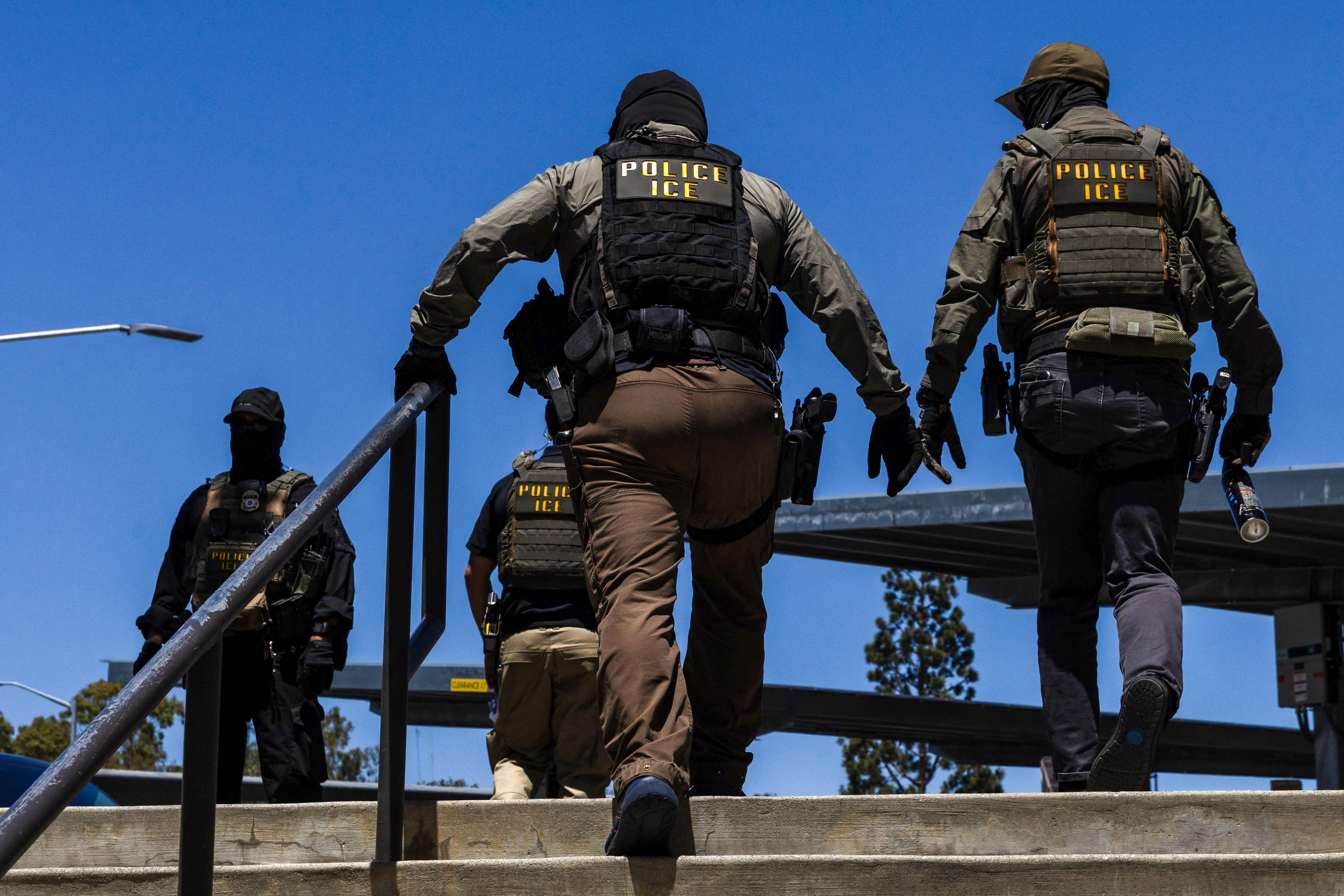 Immigration and Customs Enforcement (ICE) agents walk outside the Ventura County Government Center in Ventura, California, on July 27, 2026; illustrative.