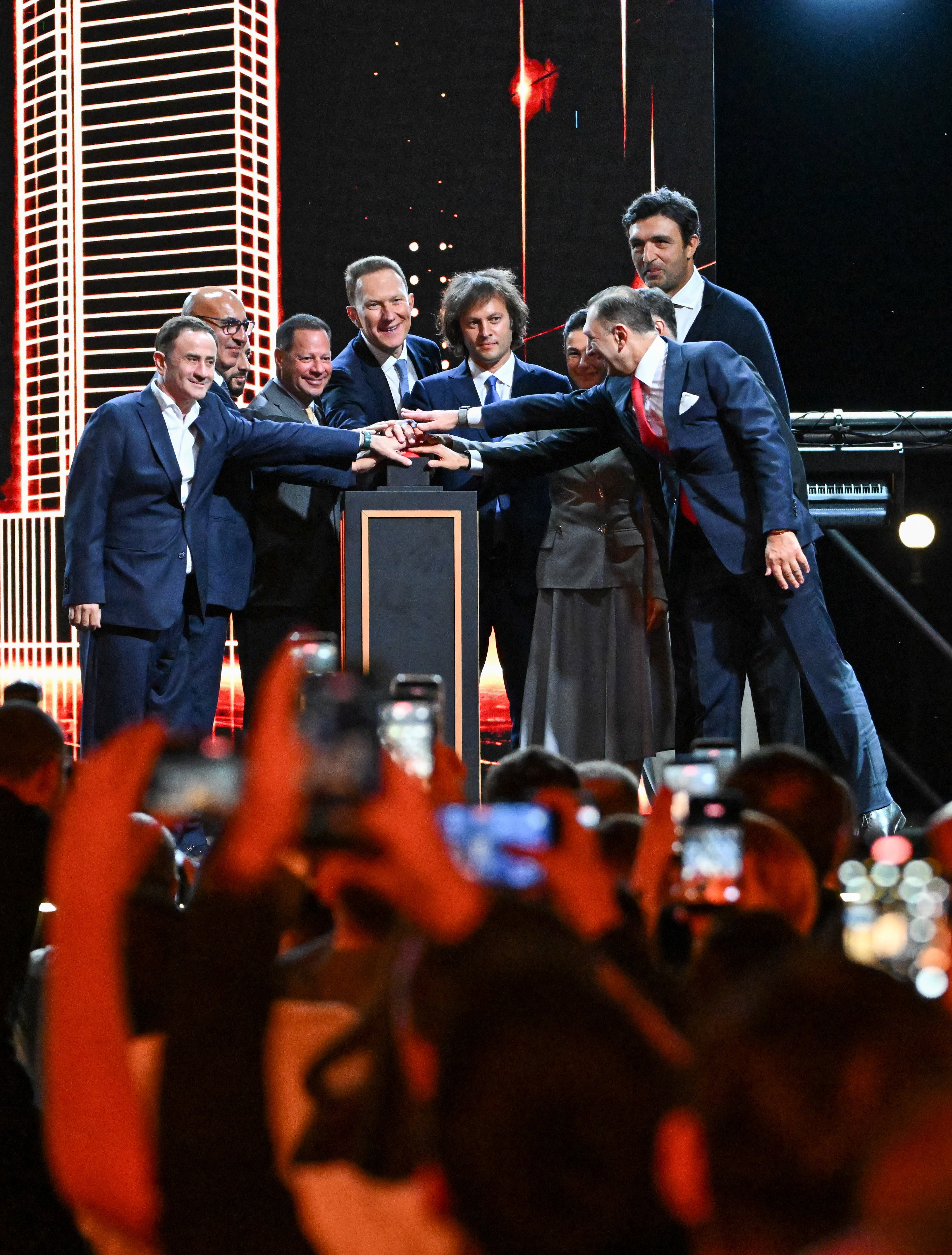 Participants, including Georgia's Prime Minister Irakli Kobakhidze, stand on the stage during the official presentation of Trump Tower Tbilisi, September 15, 2026.