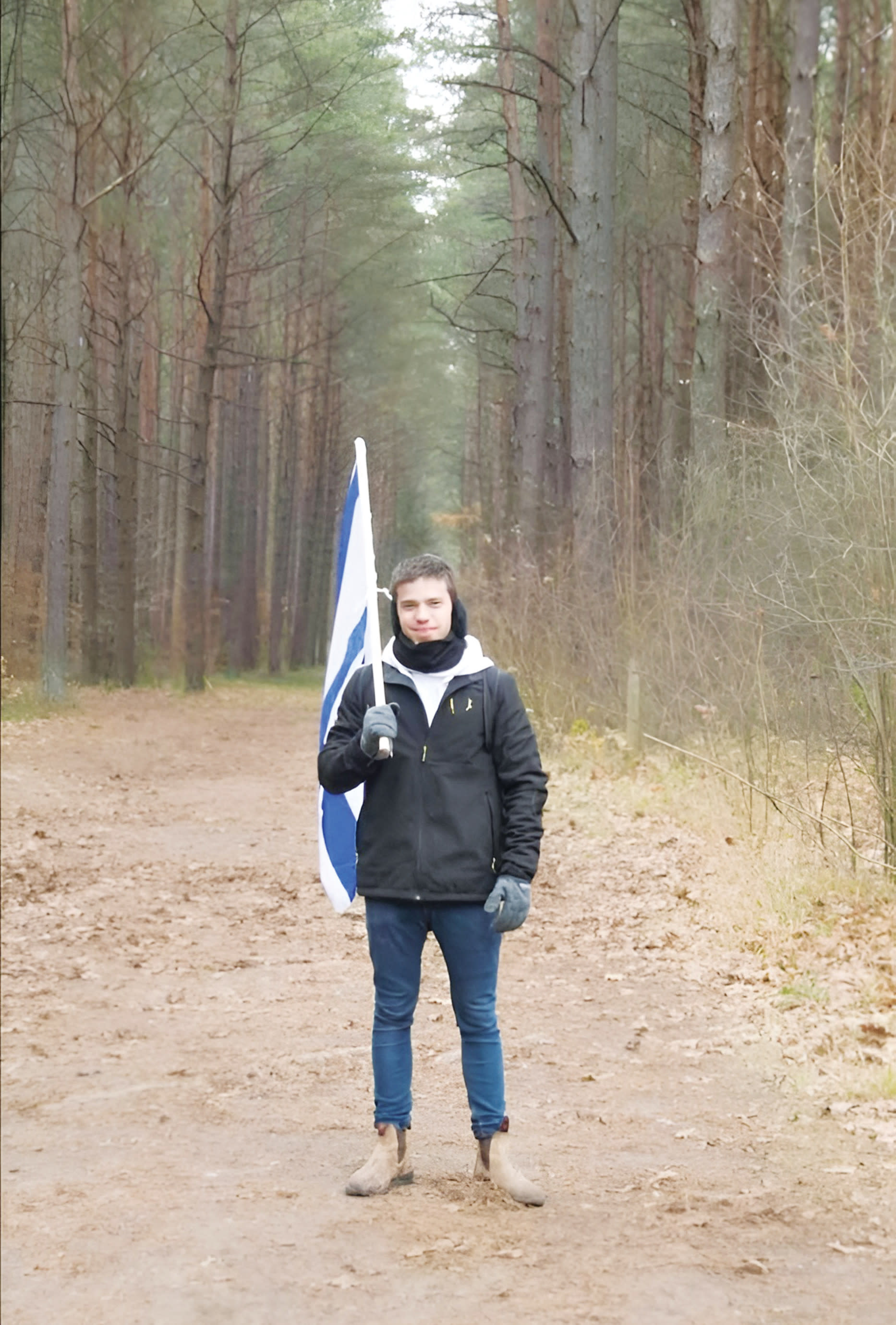 ON A TRIP to Poland, with the Israeli flag in hand.