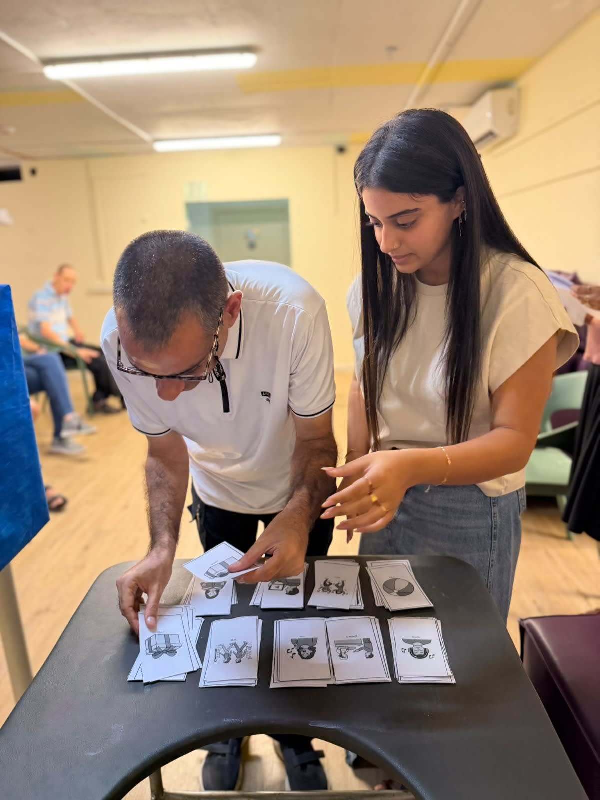 A resident of a rehabilitation village operated by Perach Israel practices voting ahead of the October 27, 2026 Knesset election.