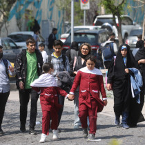 Iranian women walk on a street amid the implementation of the new hijab surveillance in Tehran, Iran, April 15, 2023.