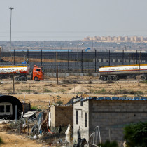  UN-flagged fuel trucks move towards the border crossing, amid the ongoing Israeli-Palestinian conflict, in Rafah in the southern Gaza Strip, October 16, 2023