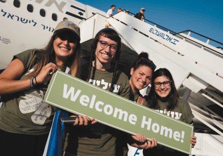 New olim are seen having arrived in Israel
