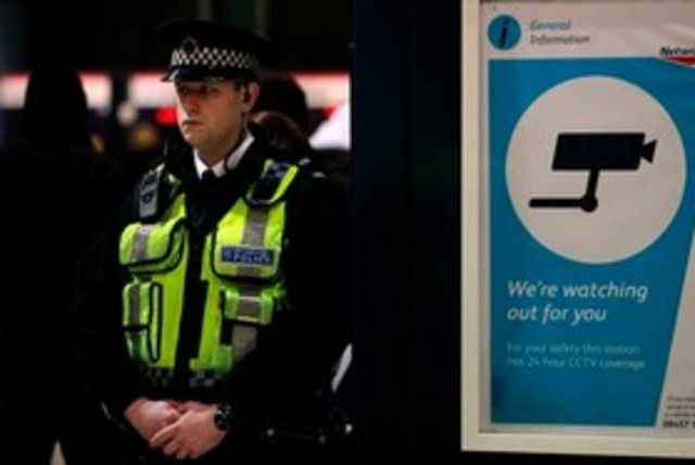 British police at airport ''watching you'' 311 AP (credit: AP)
