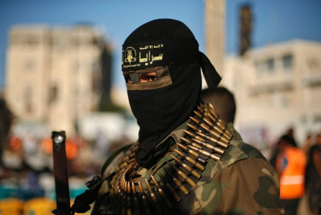 An Islamic Jihad militant attends an anti-Israel rally in Rafah. (credit: REUTERS)