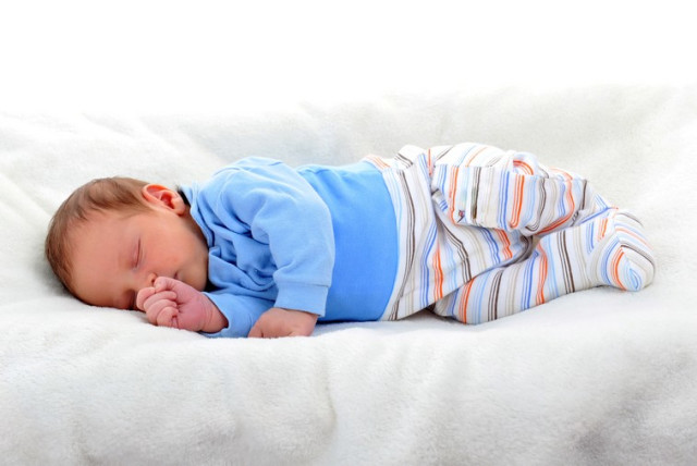 Baby boy in sleeping on bed (credit: ING IMAGE/ASAP)