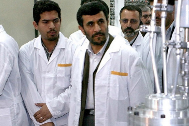 Former Iranian president Mahmoud Ahmadinejad (second left) visits the Natanz nuclear enrichment facility. (credit: REUTERS)