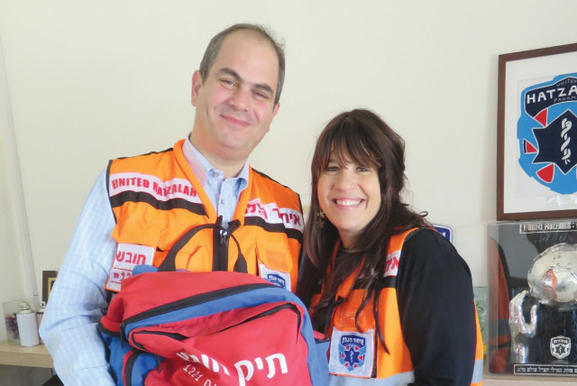 ELI AND GITTY BEER, with matching United Hatzalah vests, are both trained medics (credit: JUDY SIEGEL-ITZKOVICH)