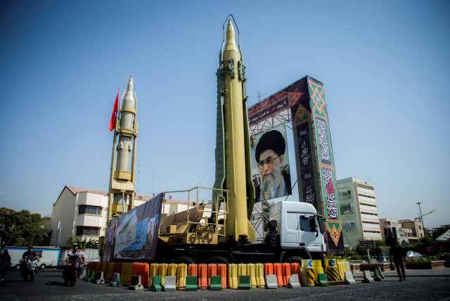 Missiles and a portrait of Iran's Supreme Leader Ayatollah Ali Khamenei in Baharestan Square in Tehran, Iran (credit: NAZANIN TABATABAEE YAZDI/ TIMA VIA REUTERS)