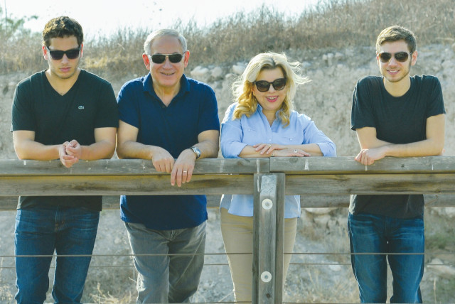 PRIME MINISTER Benjamin Netanyahu and his wife, Sara, tour the Magshimim Forest together with their sons Yair (right) and Avner in 2016. (GPO) (credit: GPO)