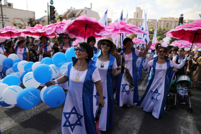 Israelis and foreign nationals participate in the Jerusalem March, an annual pro-Israel procession that takes place in the city during Sukkot, in Jerusalem, in October (credit: AMMAR AWAD/REUTERS)