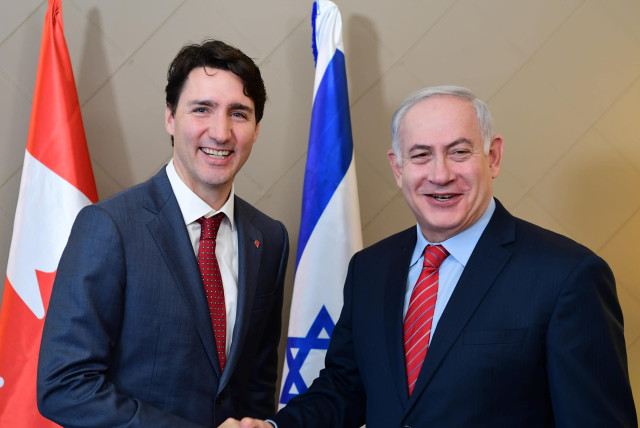 Canadian Prime Minister Justin Trudeau and Israeli Prime Minister Benjamin Netanyahu in Davos, Switzerland. (credit: AMOS BEN-GERSHOM/GPO)