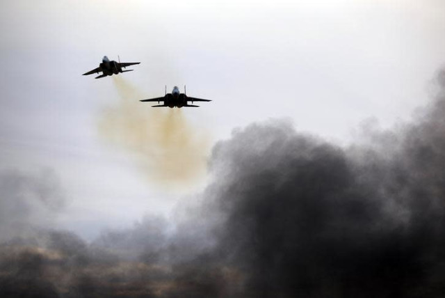 Israeli Air Force F15 planes fly during an aerial demonstration at a graduation ceremony for Israeli air force pilots at the Hatzerim air base in southern Israel, December 27, 2017. (credit: AMIR COHEN/REUTERS)