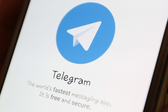 The Telegram logo is seen on a screen of a smartphone in this picture illustration (credit: ILYA NAYMUCHIN)