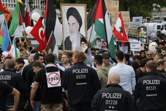 Demonstrators attend an 'al-Quds Day' protest rally in Berlin, Germany, July 11, 2015 (credit: FABRIZIO BENSCH / REUTERS)