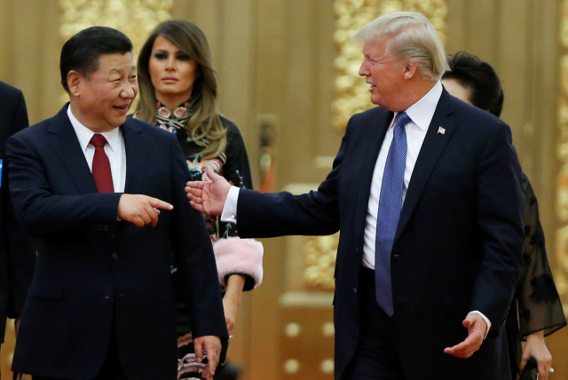 US President Donald Trump and China's President Xi Jinping arrive at state dinner, Great Hall of the People, Beijing, 2017. (credit: THOMAS PETER/REUTERS)