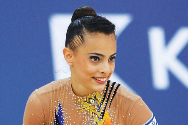 Israeli Linoy Ashram notched a silver medal in the individual Hoops competition at the Rhythmic Gymnastics World Championships this week as she continued to twirl her way toward the 2020 Olympics in Tokyo. (credit: OCI/COURTESY)
