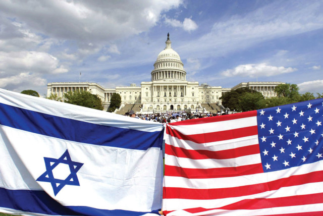 AMERICAN AND ISRAELI flags fly during a demonstration in support of Israel at the US Capitol in 2002. (credit: KEVIN LAMARQUE/REUTERS)