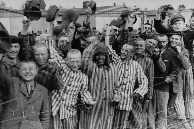 Survivors of the Nazi death camp in Dachau cheer approaching U.S. troops (credit: US NATIONAL ARCHIVES AND RECORDS ADMINISTRATION/WIKIMEDIA COMMONS)