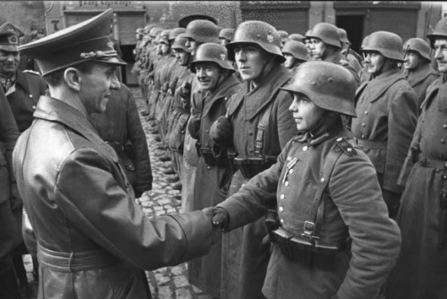 9 March 1945: Goebbels awards a 16-year-old Hitler Youth, Willi Hübner, the Iron Cross for the defence of Lauban (credit: Wikimedia Commons)