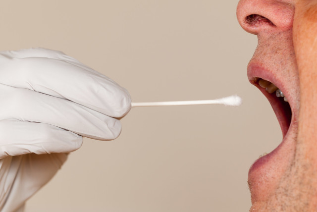An illustrative image of a mouth swab for DNA testing (credit: INGIMAGE)
