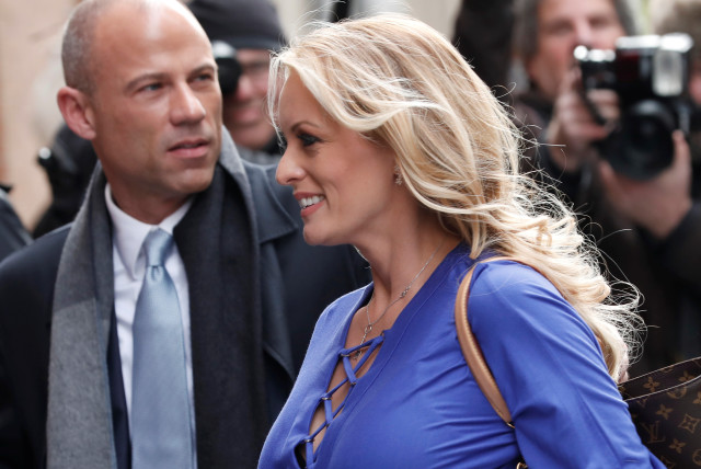 Adult-film actress Stephanie Clifford, also known as Stormy Daniels, arrives with her attorney Michael Avenatti (L) at ABC studios to appear on The View talk show in New York City, New York, U.S. (credit: REUTERS/MIKE SEGAR)